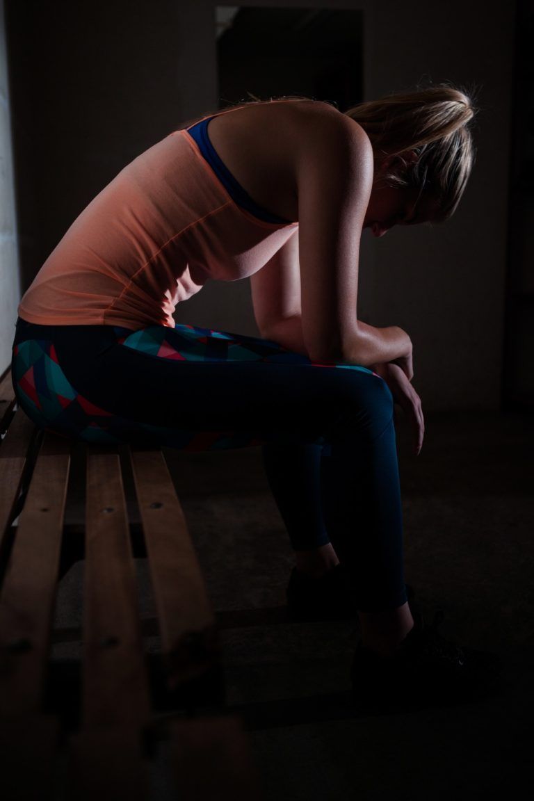 Sad woman relaxing on bench